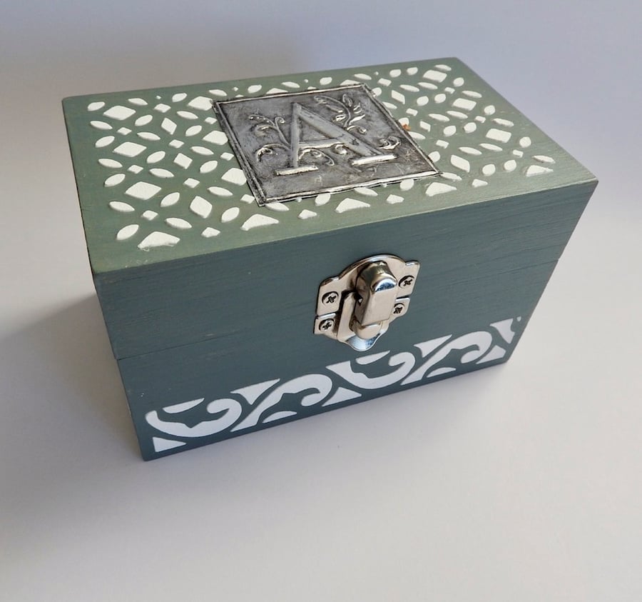 wooden trinket box with metal embossed design