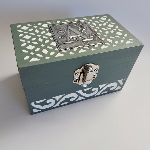 wooden trinket box with metal embossed design