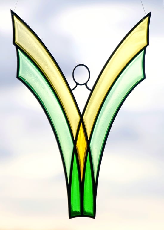 Angel suncatcher - hand made stained glass design in green-tinted resin.