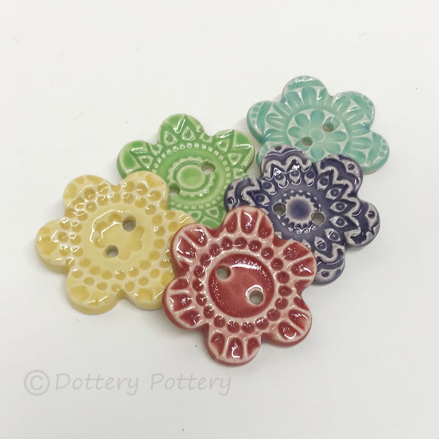 Set of five flower shaped ceramic handmade buttons