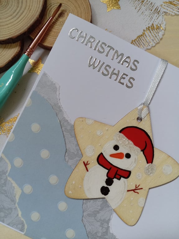 Christmas card with a wooden snowman decoration