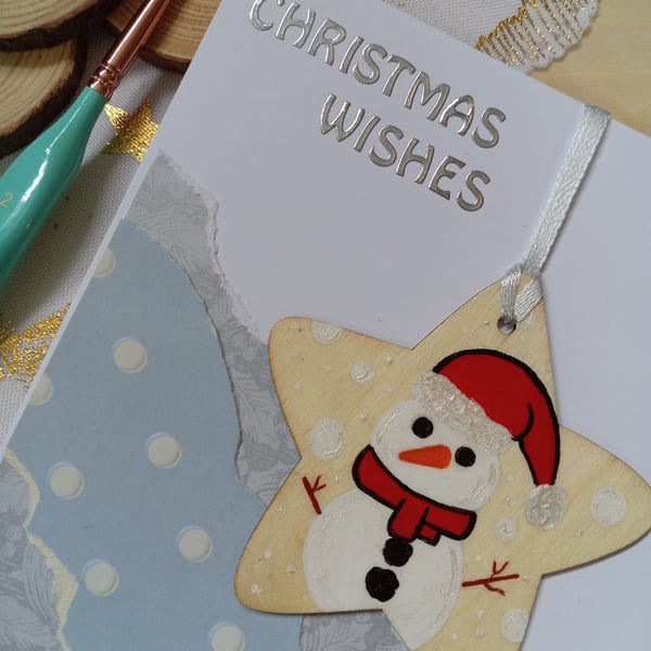 Christmas card with a wooden snowman decoration