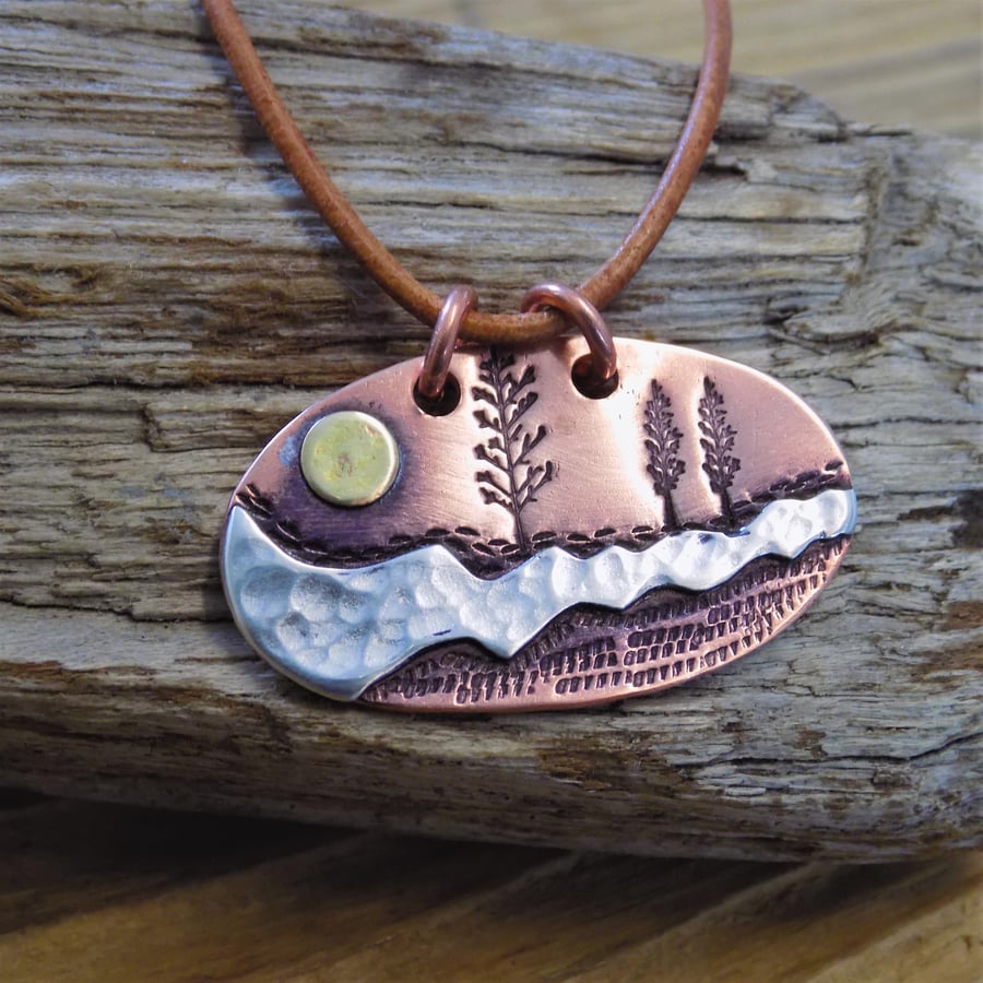 Copper, silver and brass 'sundown' mixed metal scene pendant 