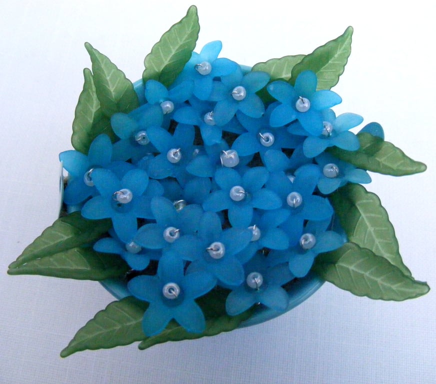 Blue bucket of forget-me-nots decoration.