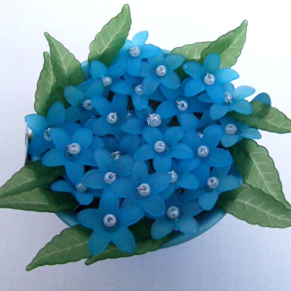 Blue bucket of forget-me-nots decoration.