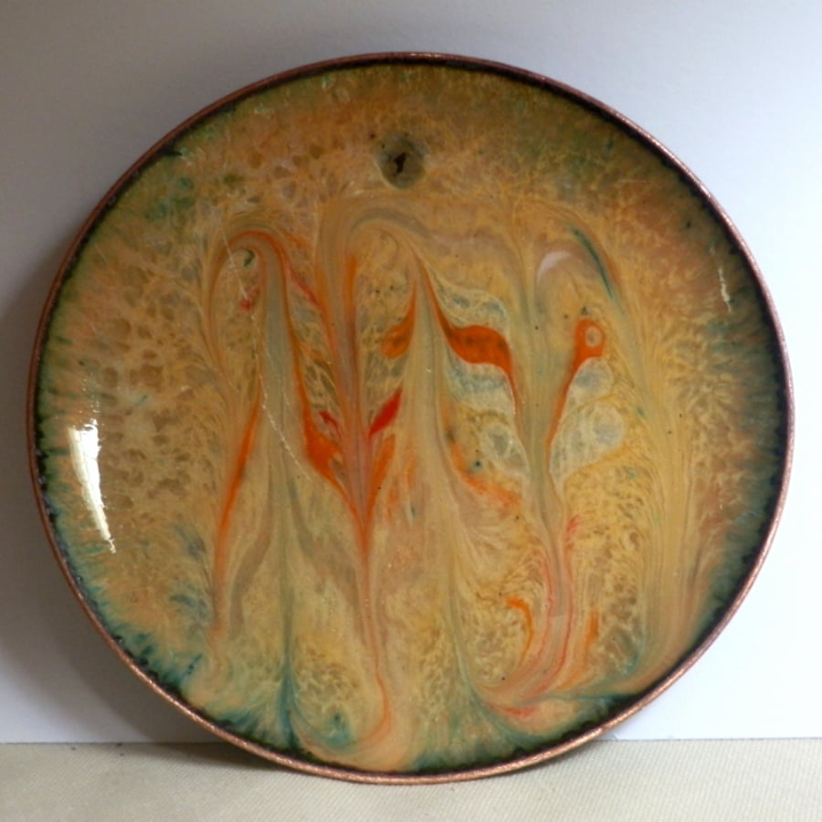 dish scrolled orange-red and white on pale brown enamel
