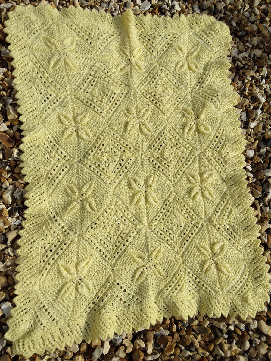 Yellow hand knitted baby blanket