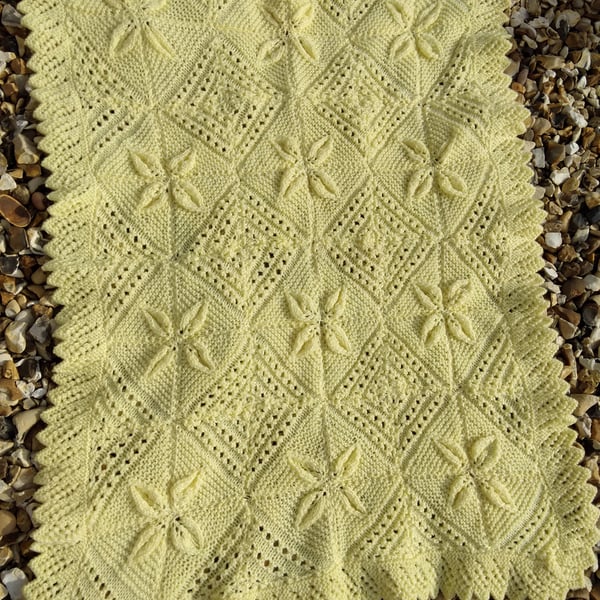 Yellow hand knitted baby blanket