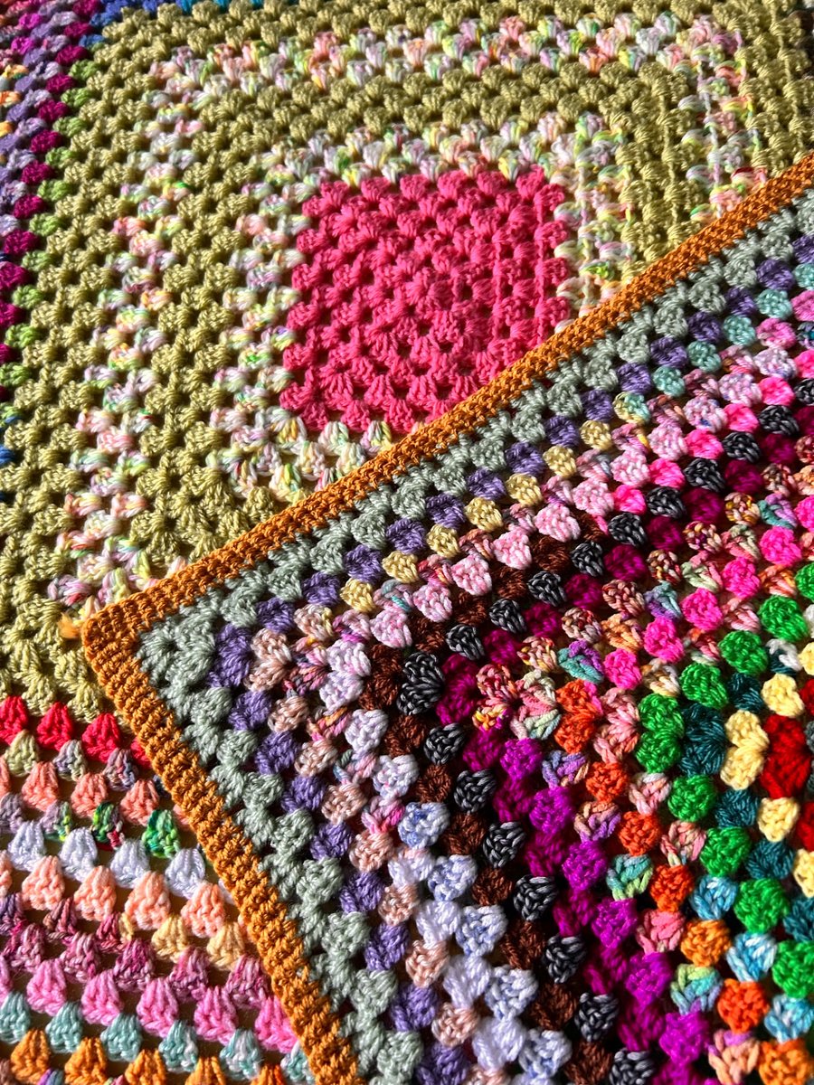 A handmade vintage crochet granny square blanket sofa throw