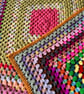 A handmade vintage crochet granny square blanket sofa throw
