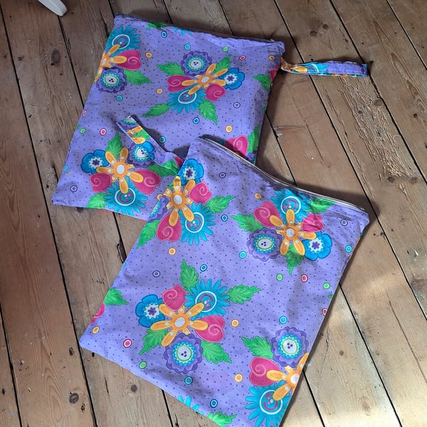 Bright floral reusable wet bag with day glo orange lining
