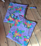 Bright floral reusable wet bag with day glo orange lining