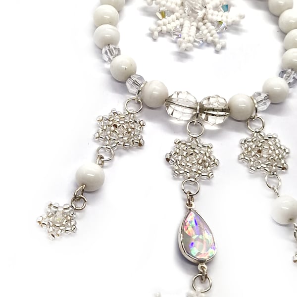 Silver and white snowflakes and stars hanging Christmas decoration