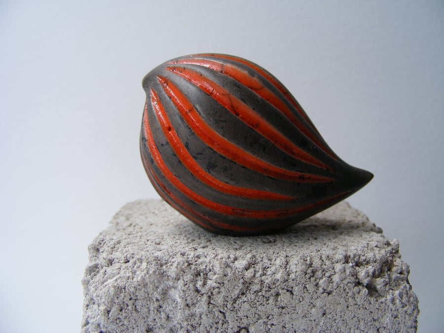 Baby carved bird, raku