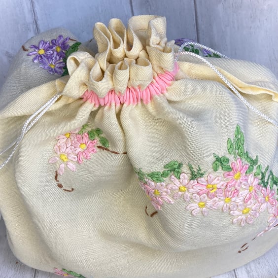 Travel packing laundry bag made from vintage embroidered cloth