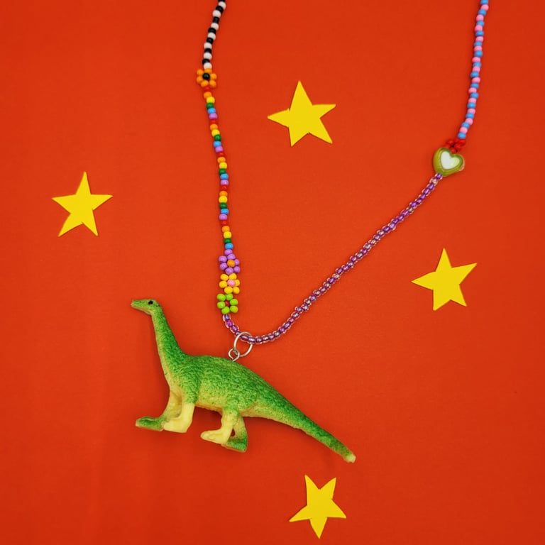 Hand-beaded necklace with up-cycled dinosaur charm