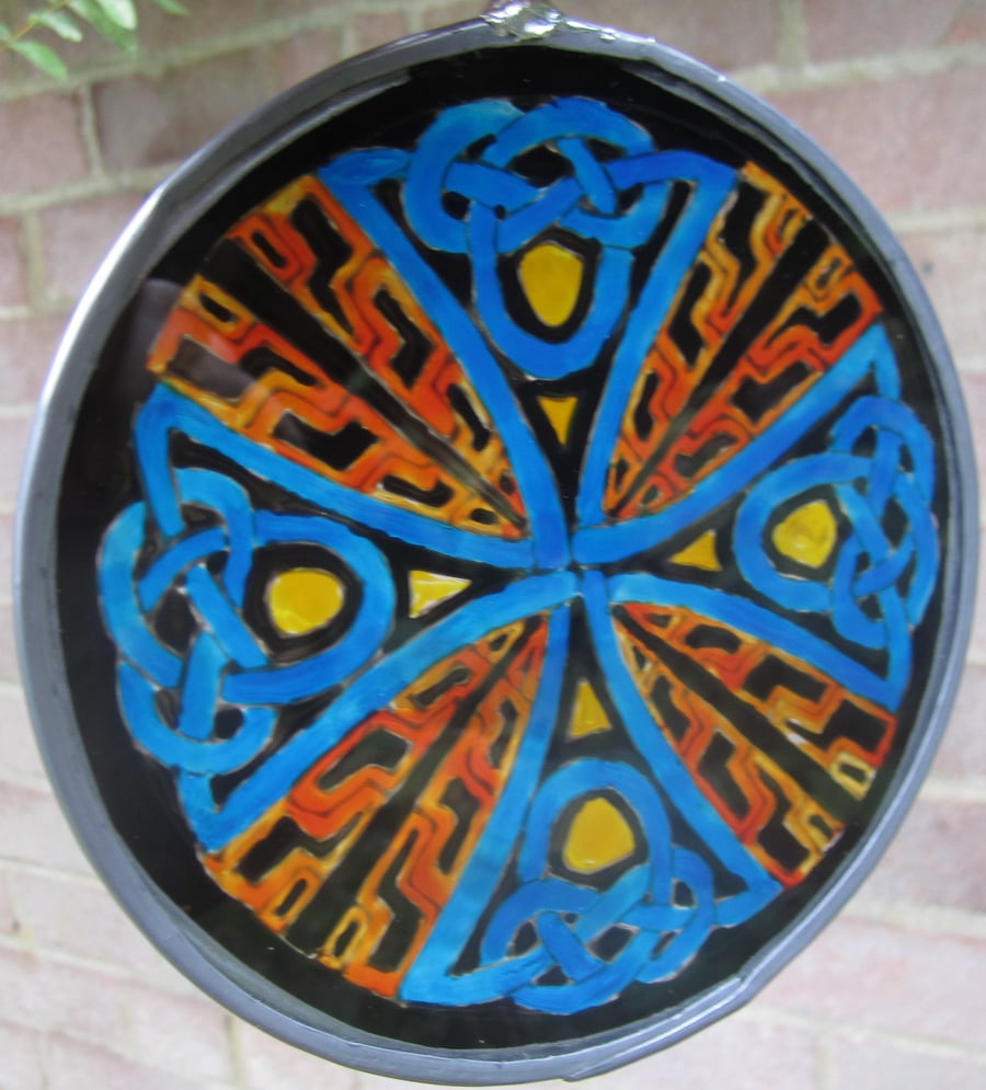 Suncatcher - Celtic Knot Cross in orange, red, yellow, black and blue - Medium