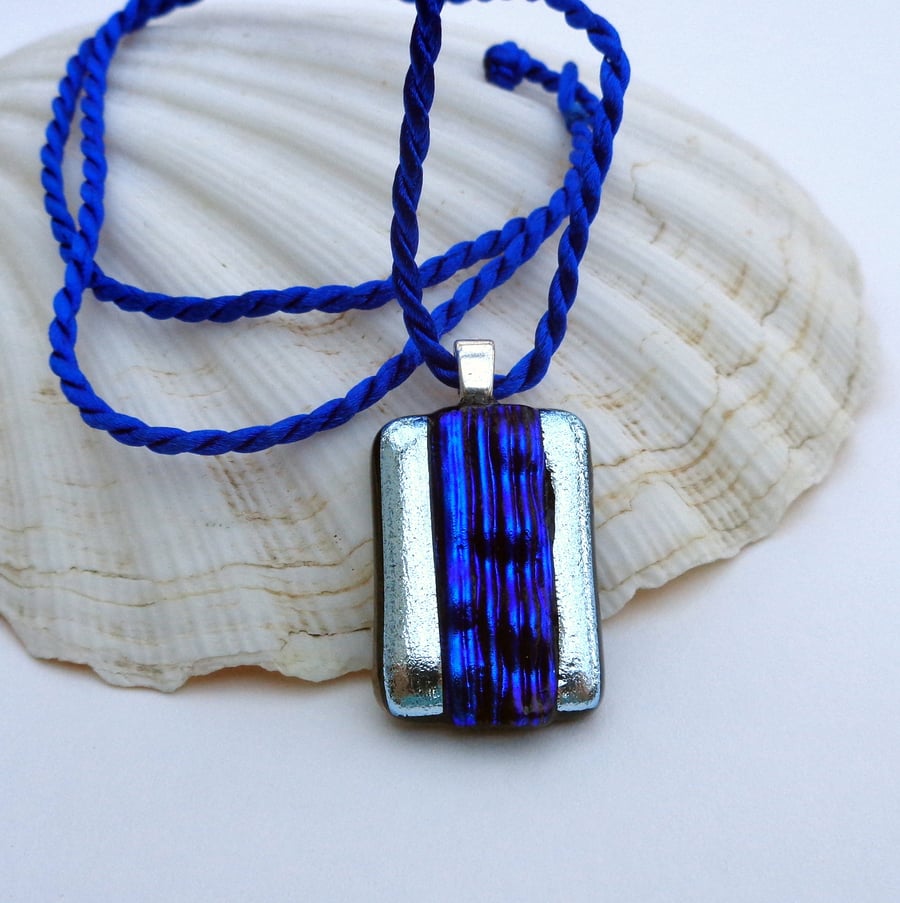 Dichroic fused glass pendant in blue & silver "A river runs through it"