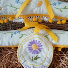 A pair of coathangers, covered with vintage linen.Price inc P and P.