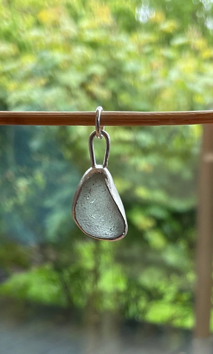 A beautiful sea-foam coloured seaglass pendant set in sterling silver.