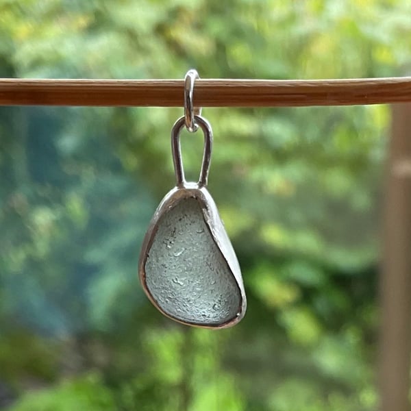 A beautiful sea-foam coloured seaglass pendant set in sterling silver.