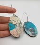 Oval shaped earrings in a watery effect print, blues, white, grey and pink - Image 2