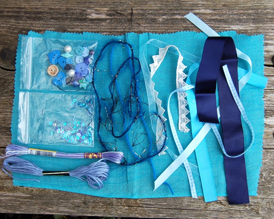 Upcycled slow stitching kit includes fabric, buttons, thread, lace, ribbon
