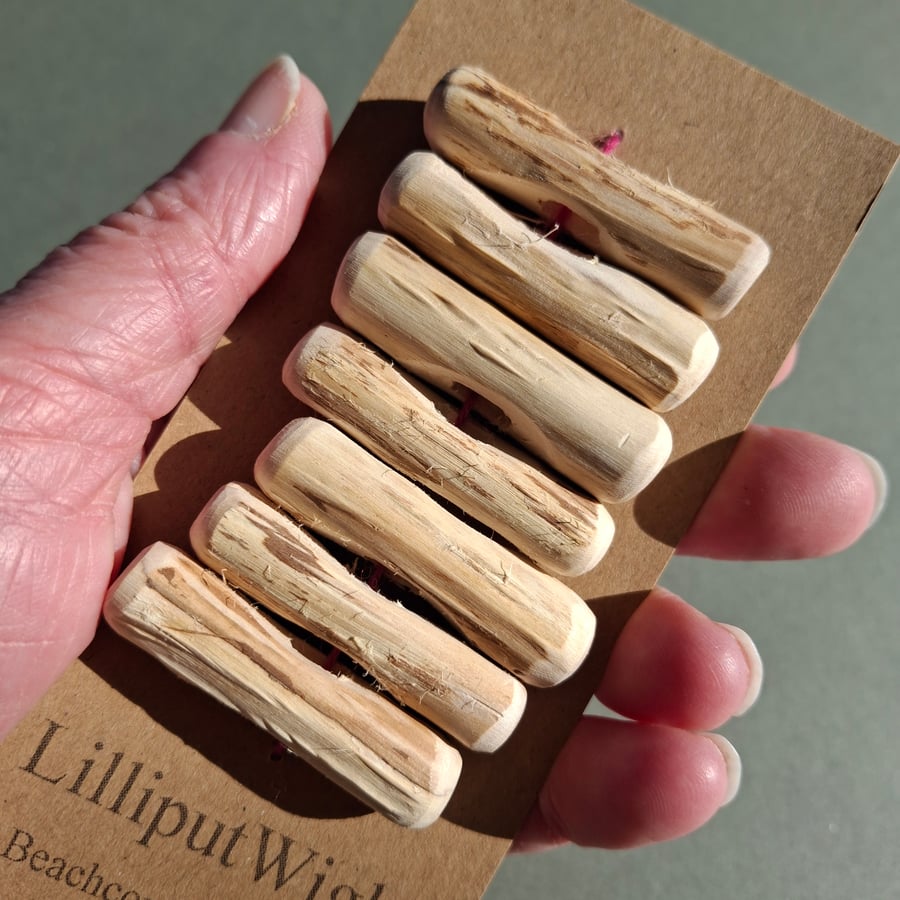 Set of seven driftwood toggle buttons with single hole