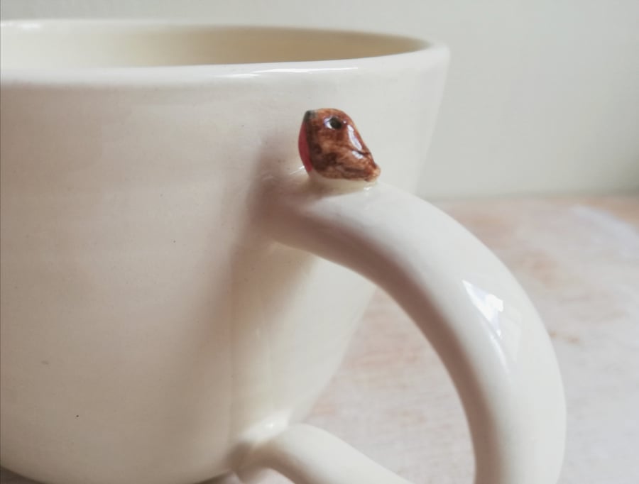 Hand thrown ceramic robin mug with tiny Christmas bird gardeners gift
