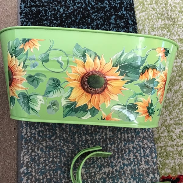 Green fence planter with stunning sunflowers motif
