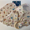 Four piece baby set - two bibs, shaped burp cloth & bunny eared teether 