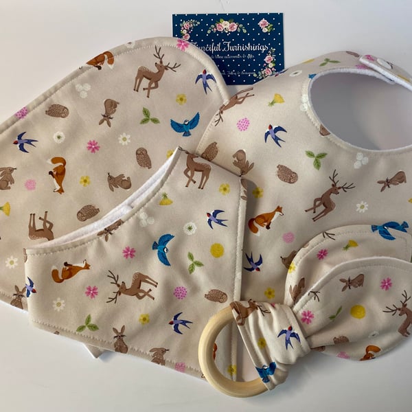 Four piece baby set - two bibs, shaped burp cloth & bunny eared teether 