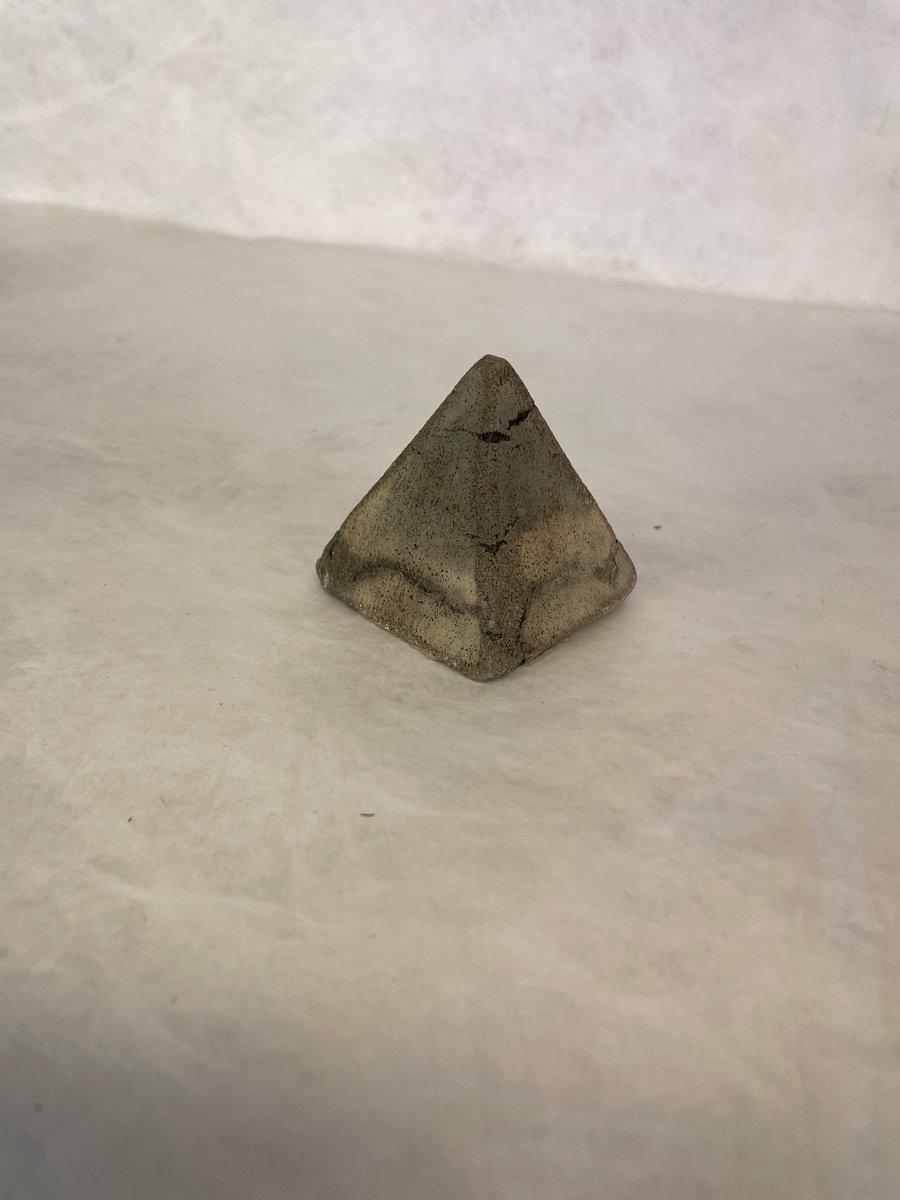 Pyramid made from traditional concrete mixtures indoor or garden ornament