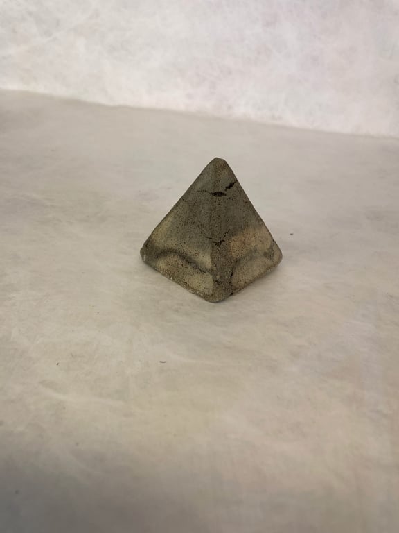 Pyramid made from traditional concrete mixtures indoor or garden ornament