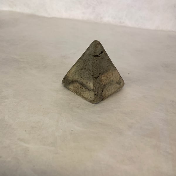 Pyramid made from traditional concrete mixtures indoor or garden ornament