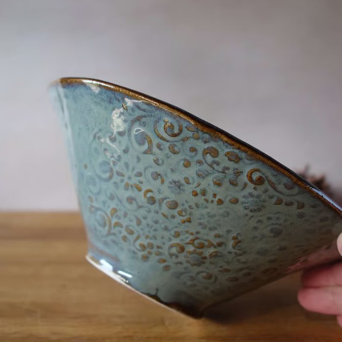 Textured conical slab made pottery bowl in blue with brown highlights 