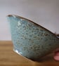 Textured conical slab made pottery bowl in blue with brown highlights 
