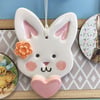 Ceramic Easter Bunny decoration with orange flower