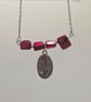 Pink mother of pearl beaded necklace with silver floral charm - Image 5
