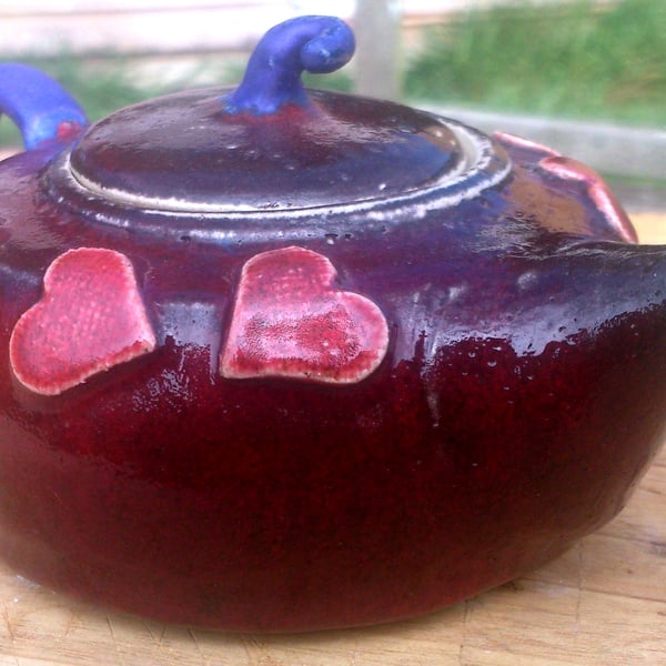 Delightful heart decorated stoneware teapots