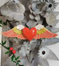 Heart sculpture, red ceramic heart with wings in lime green and pink