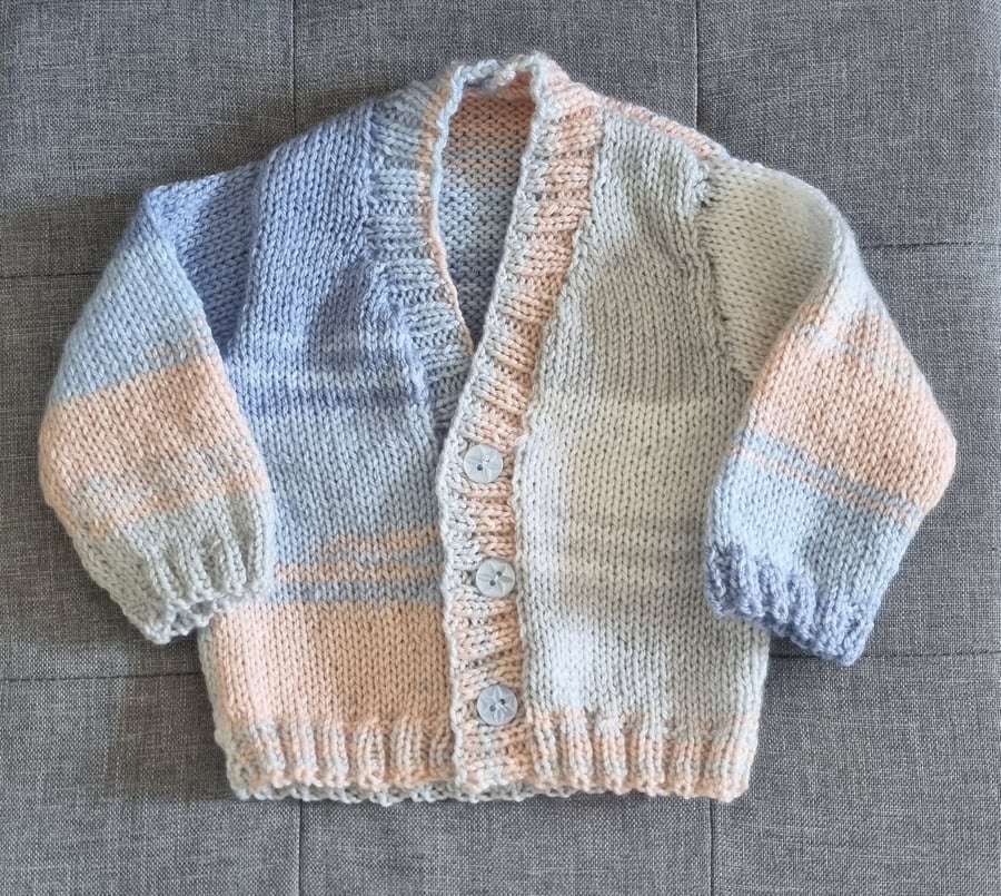 Newborn to 6 months hand knitted baby cardigan in blue, ivory and beige tones 