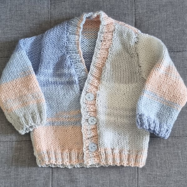Newborn to 6 months hand knitted baby cardigan in blue, ivory and beige tones 