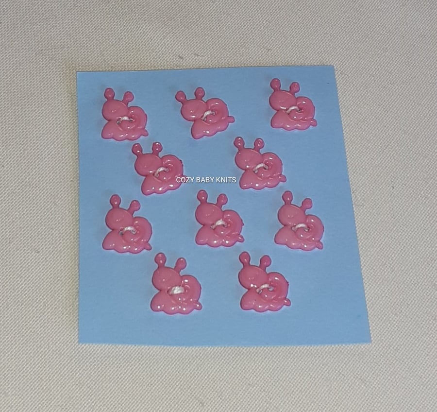 PINK SNAIL SHAPE BUTTONS WITH TWO HOLES FOR ATTACHING 