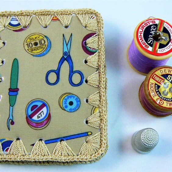 Needle case (beige crochet and material ) featuring wipe clean cover.