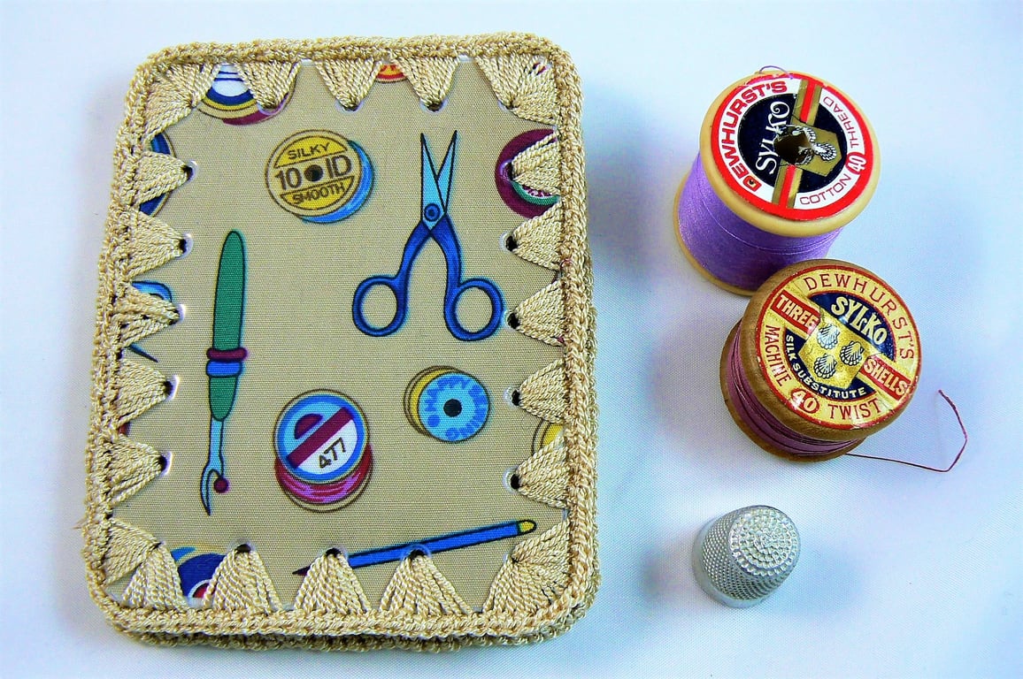 Needle case (beige crochet and material ) featuring wipe clean cover.