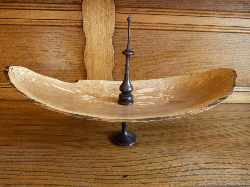 A FINIALED WOOD PEDESTAL BOWL--DISH.