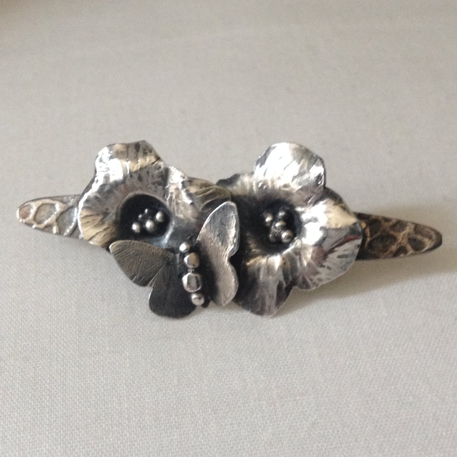 Silver flowers and butterfly brooch
