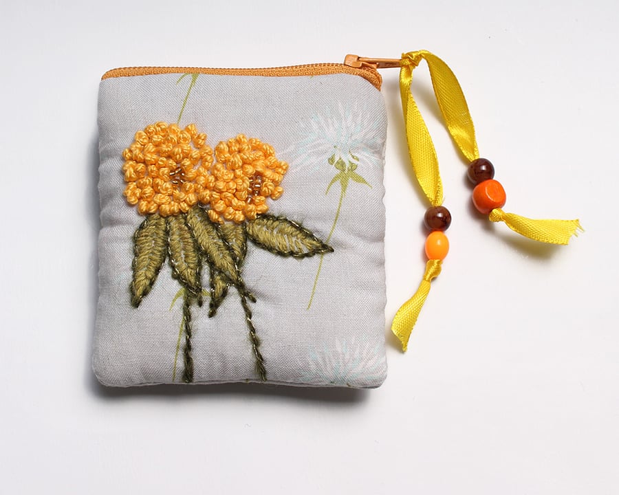 Pale grey thistle print purse with hand embroidered yellow clover