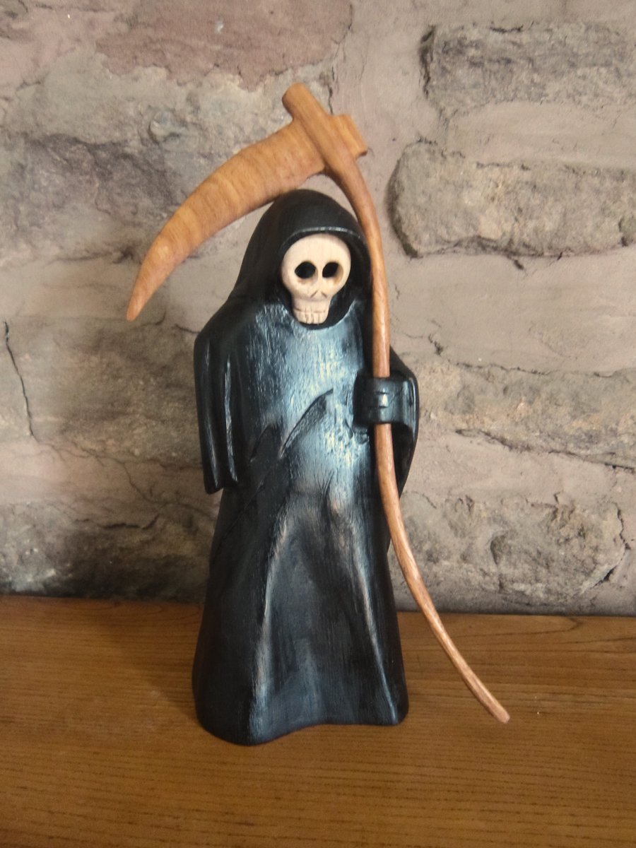 carved wooden Grim Reaper